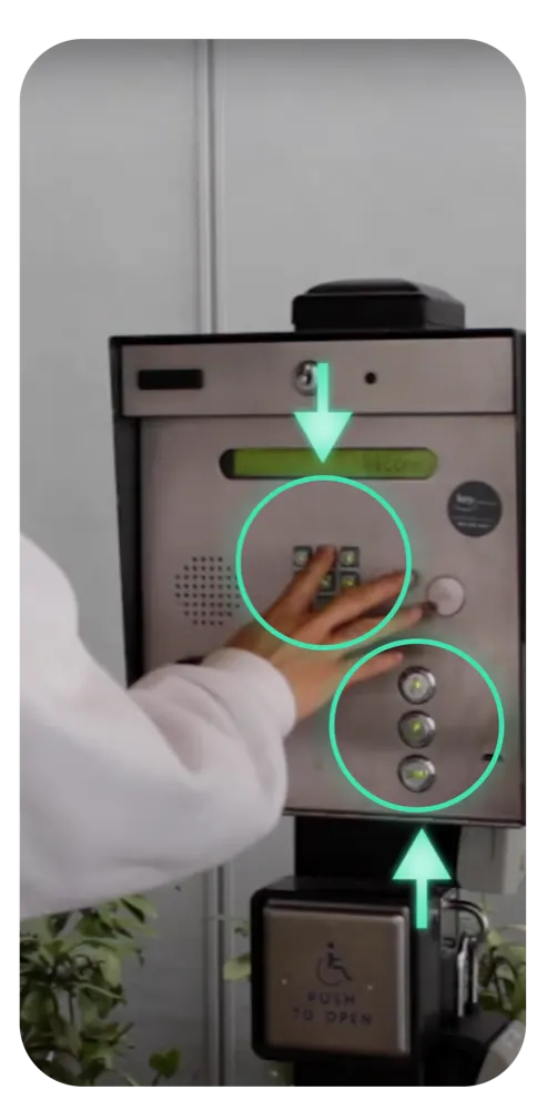 A visitor dialing a unit on an apartment buzzer panel